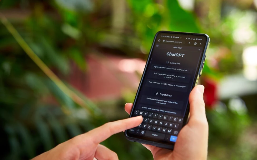 A real estate agent reviewing content strategy on a laptop with a neighborhood map visible in the background — content marketing for Florida real estate agents by C2 Communications.